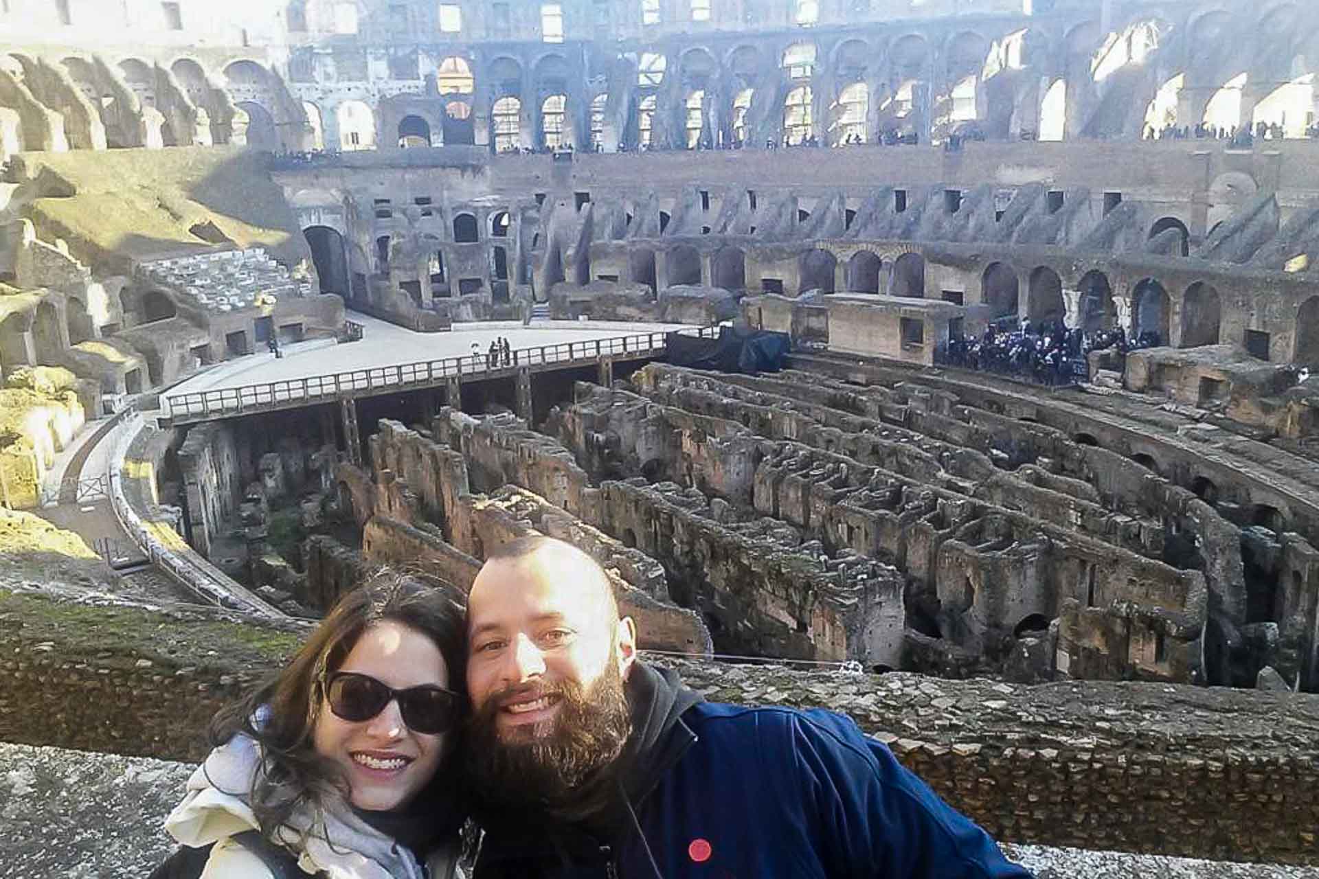Tiago and Fernanda inside the Colosseum in Rome Italy