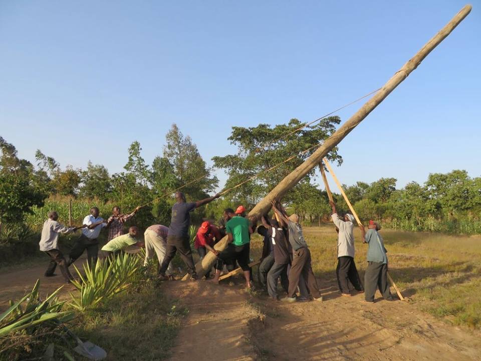 doing a Harambee to lift a lamp post in Kenya