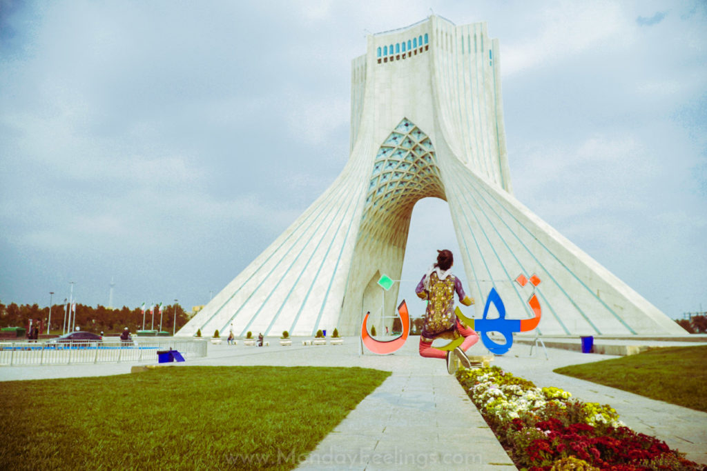 Fernanda jumping in front of Azadi Monument like singing in the rain