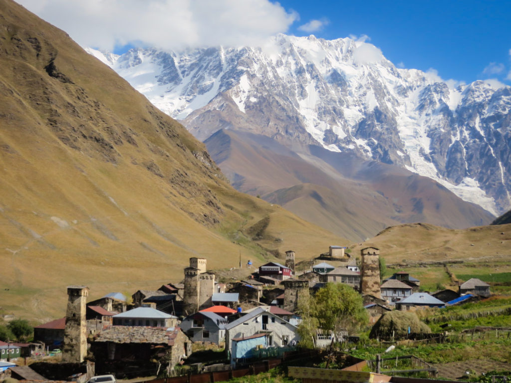 A remoto village in a valley in front of a glacier in Ushguli, Georgia