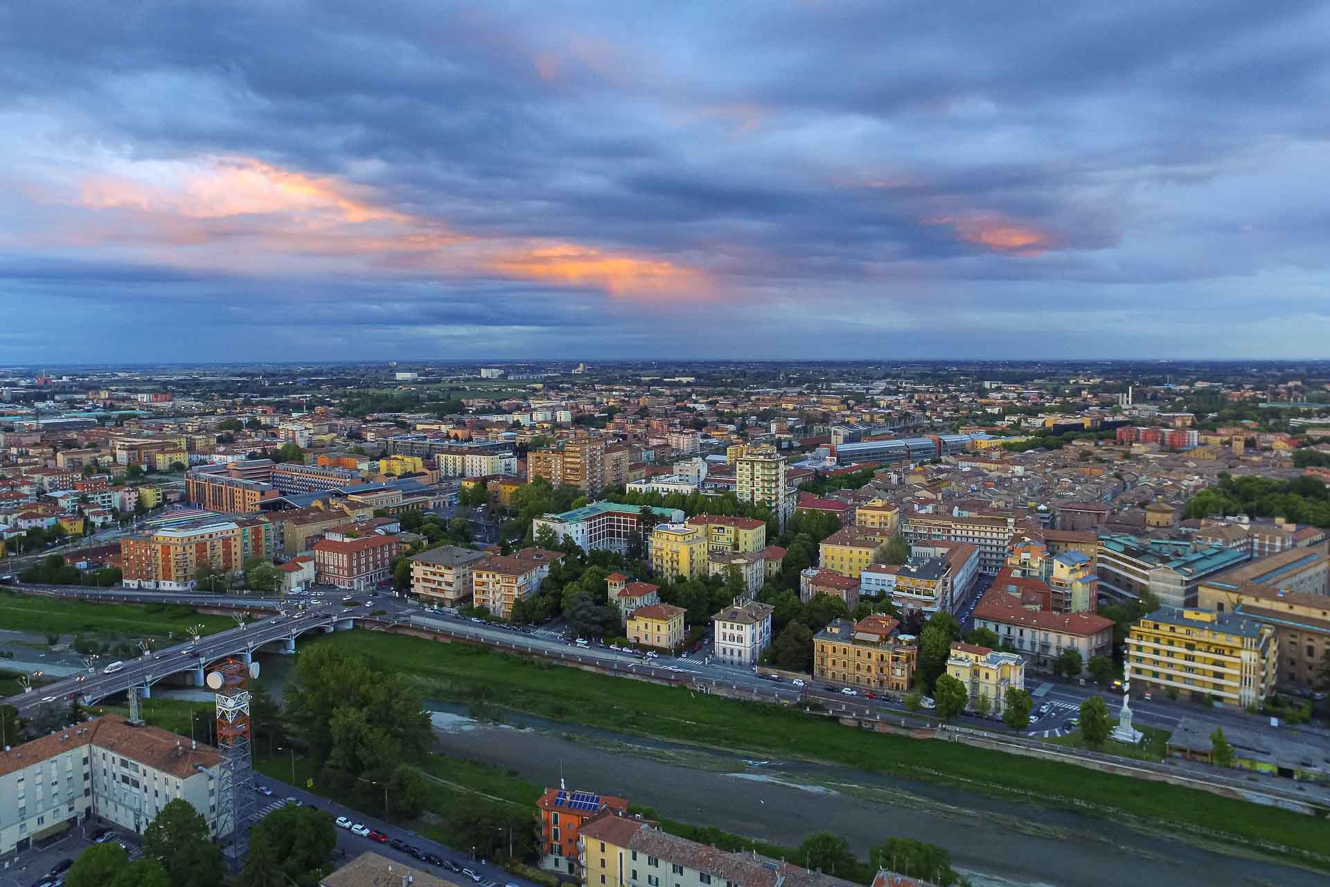 Aerial view of Parma in Italy with a few rays of sun in the clouds