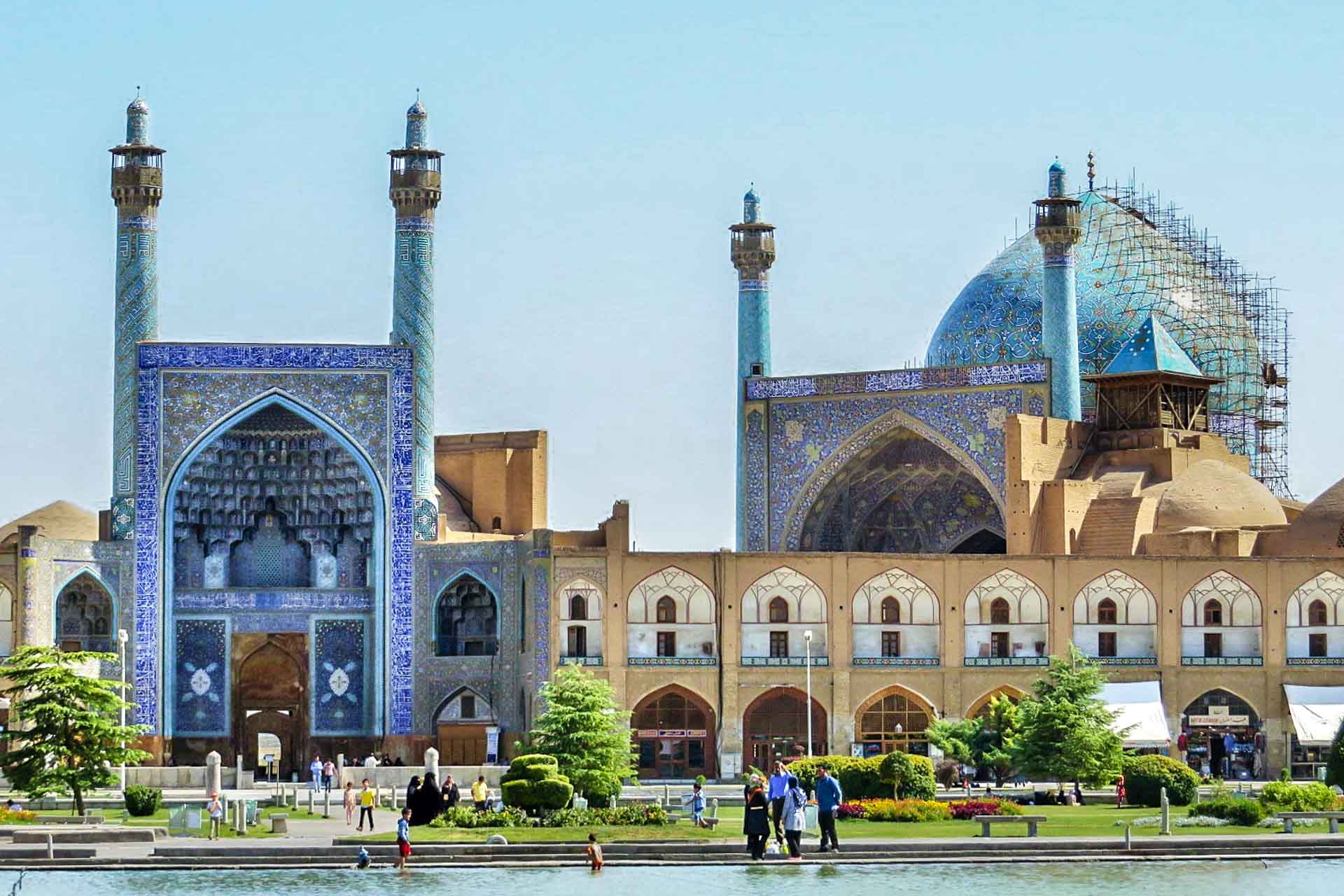 Shah Mosque in Isfahan with people in front of the lake