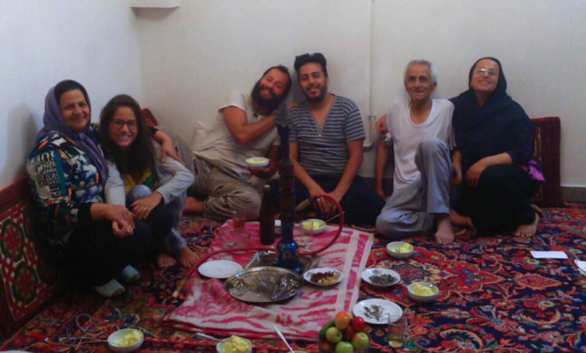 people sitting on the floor to eat in Iran