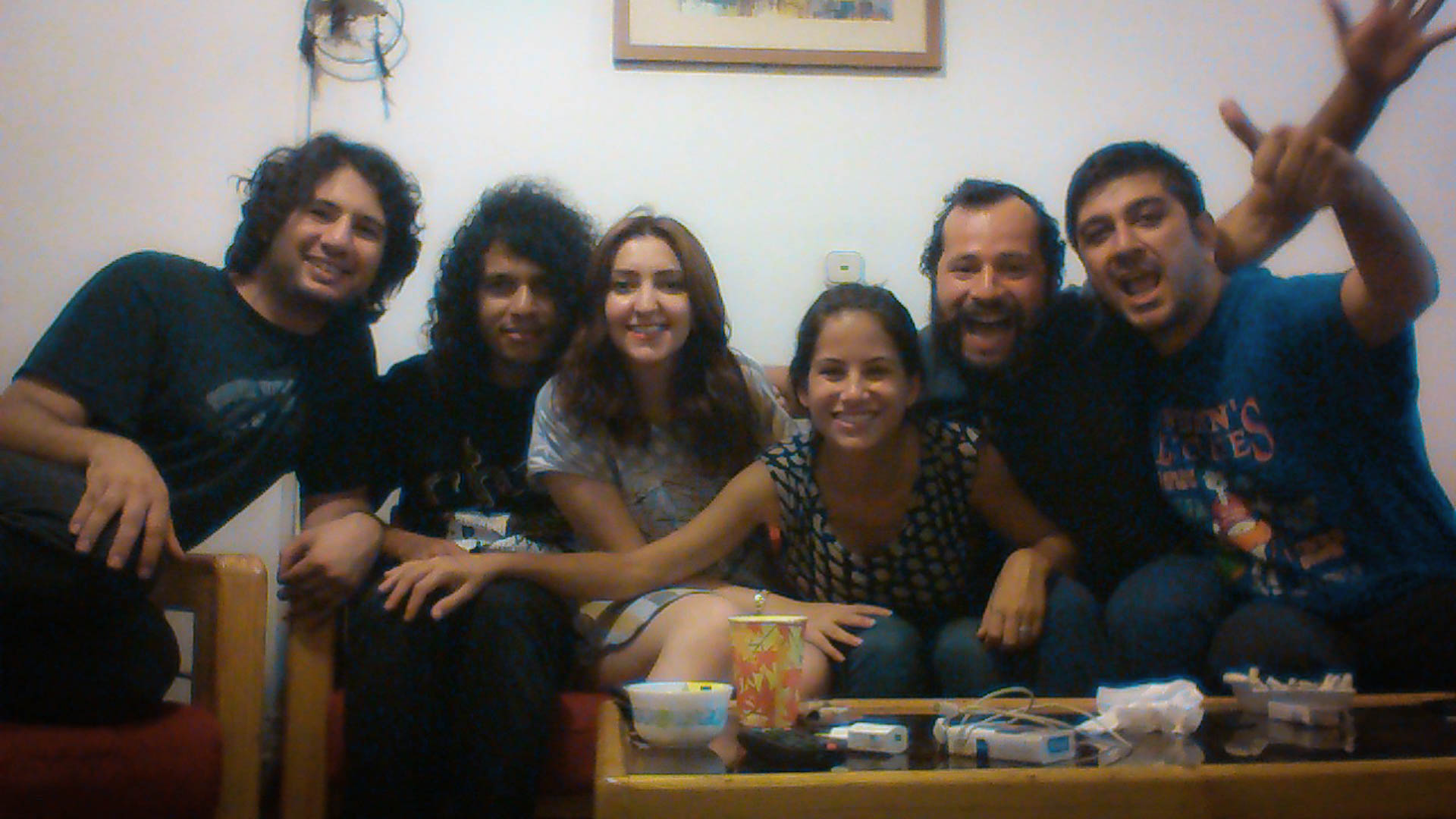 people smiling and posing for a picture sitting on a sofa in Tehran