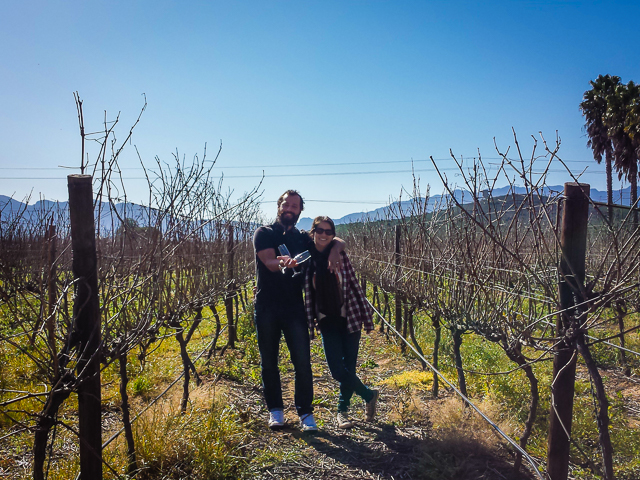 Tiago and Fernanda in between vines