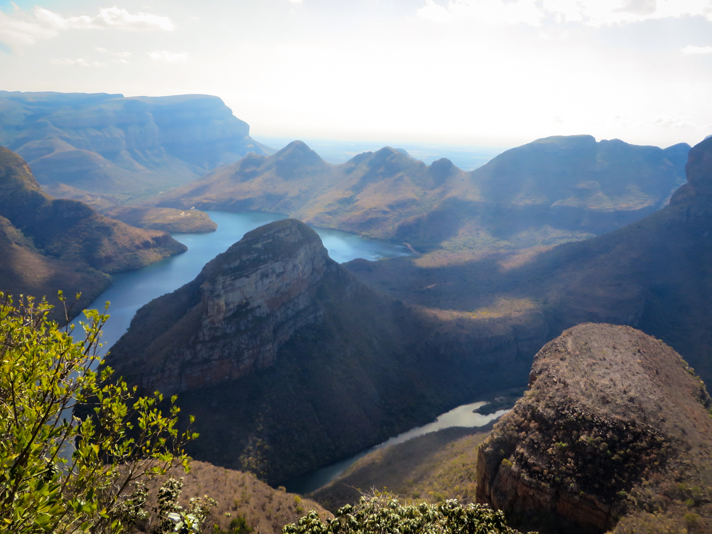 A large valley with a river crossing in the middle