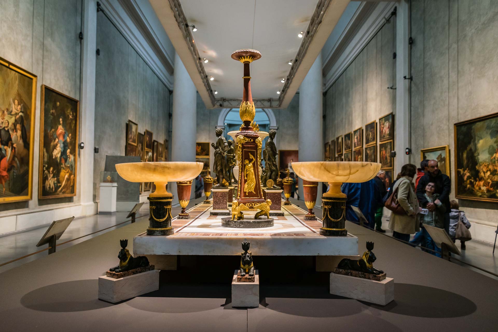 Two art on a table inside a room in a museum in Italy