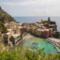 View of Vernazza in Cinque Terre from above the mountain with the beach and the village