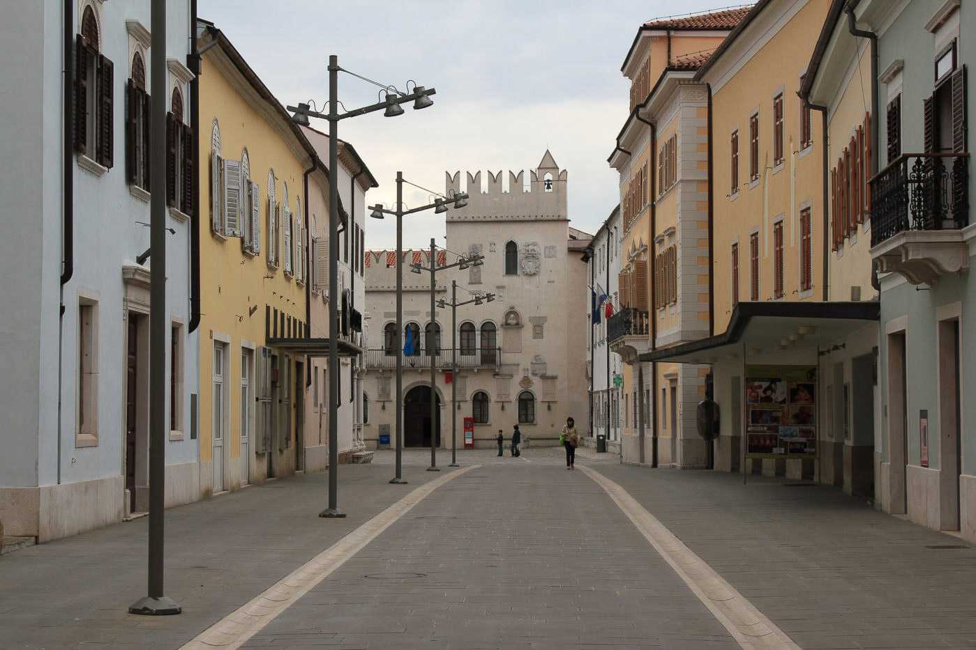 A street of Koper with a small castle in the background