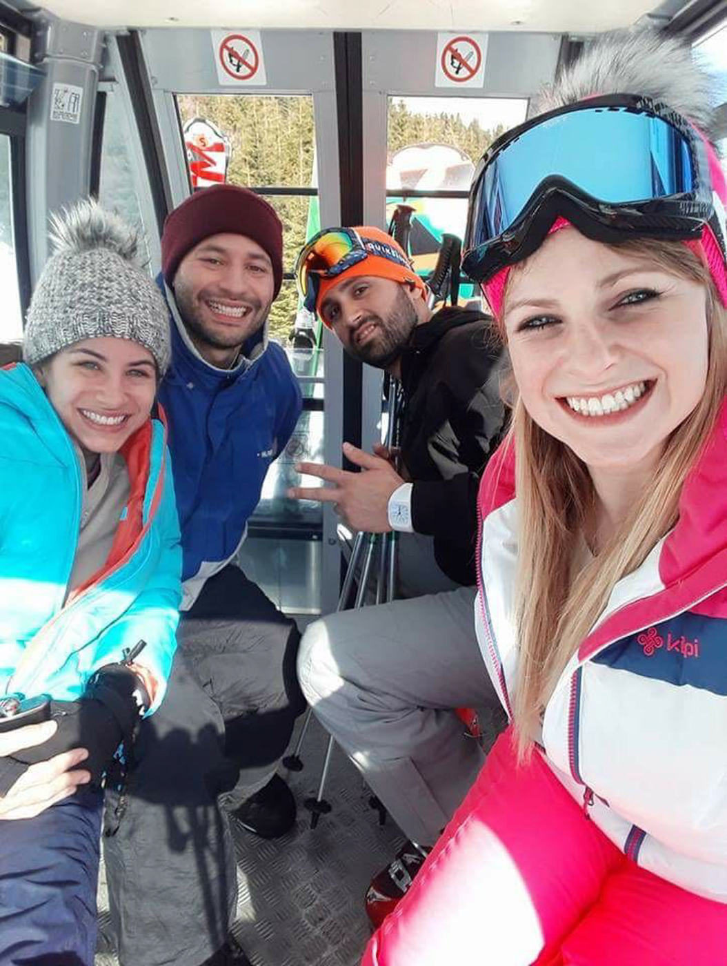 Four of us on a cable car going up the mountain in Czech Republic