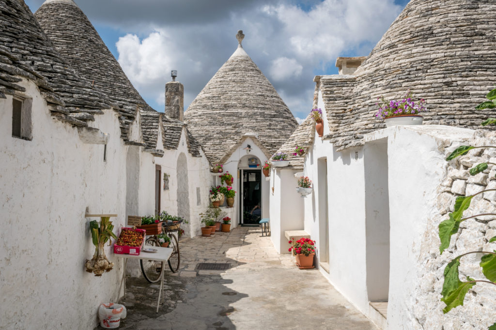 Puglia itinerary one street of Alberobello, Puglia and trulli