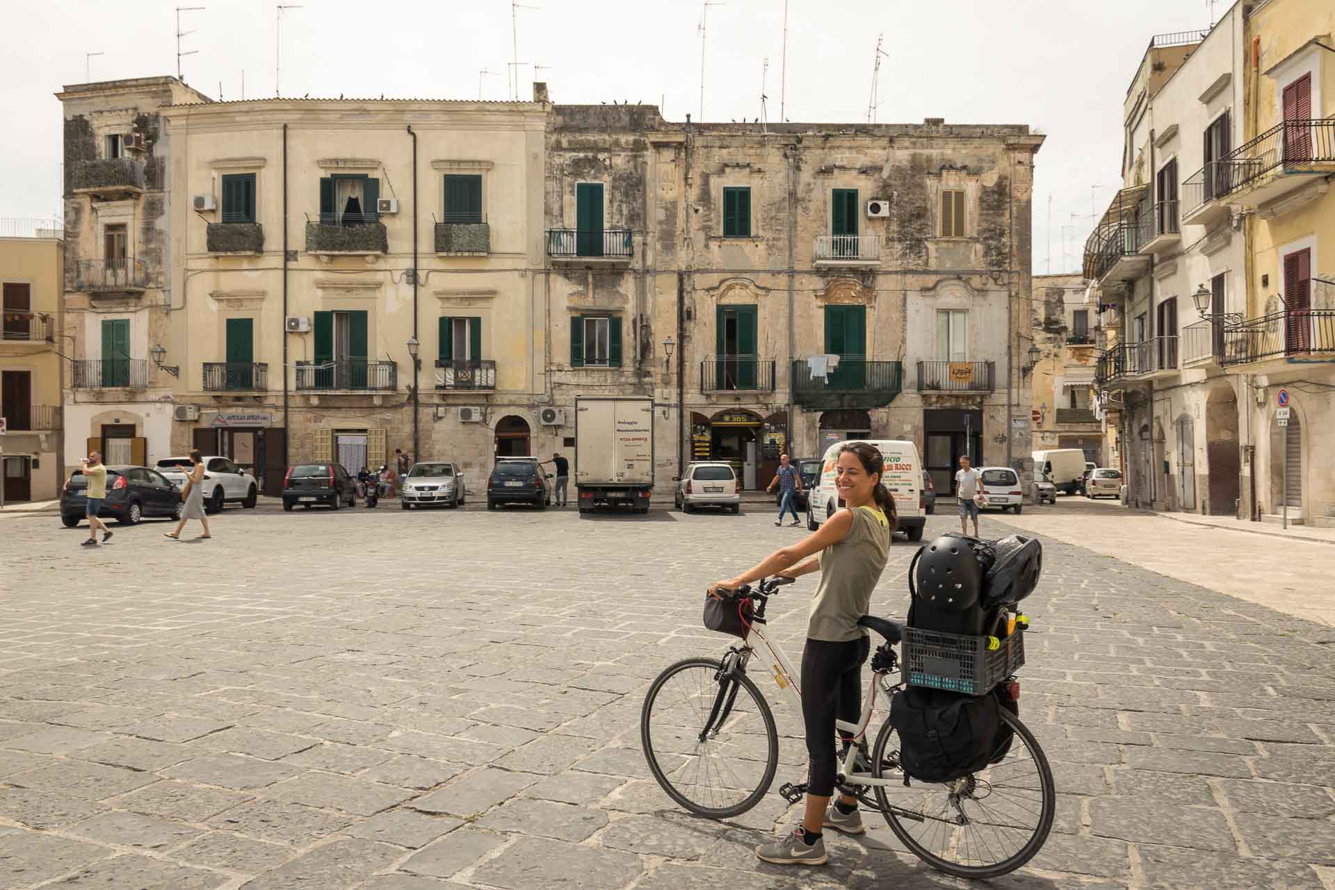 Fernanda on her bike arriving in the middle of the square in Bari, Puglia