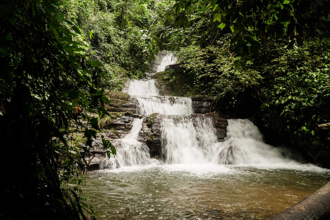 waterfall with many falls in the forest