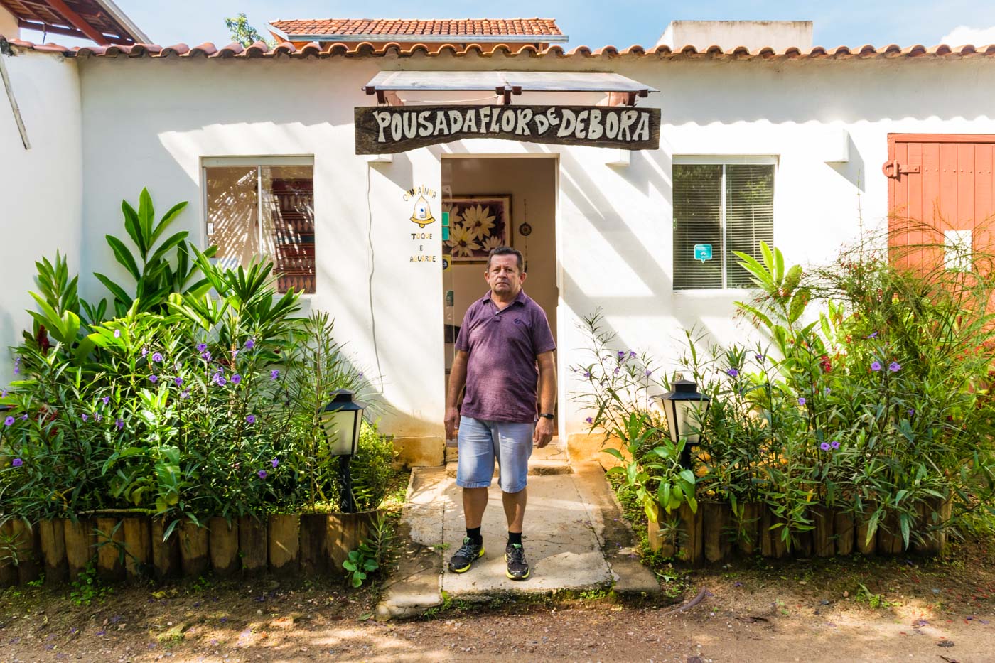 the owner of Flor de Debora Inn at the entrance