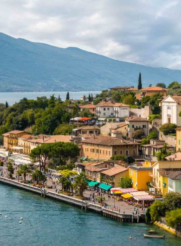Overview of Limone sul Garda in Italy with the small village by the lake with the church on the highest part of town