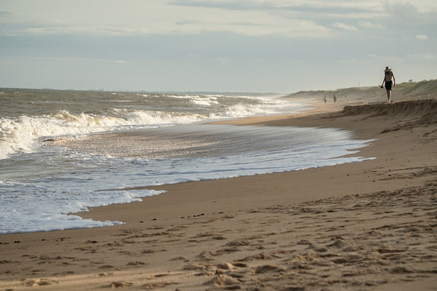 the beach of Itaunas with the wave breaking in the sand