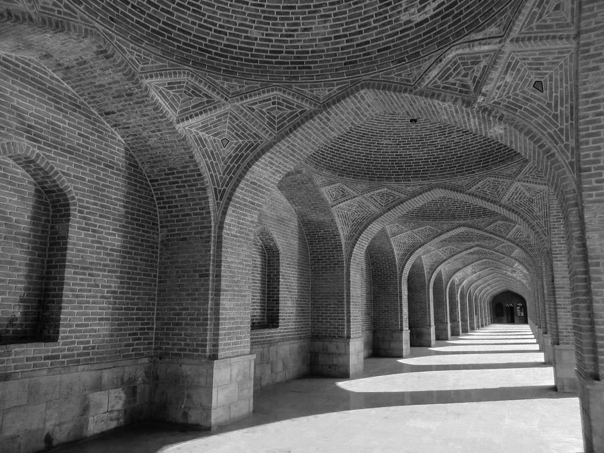 Black and white hall way outside a mosque in Iran