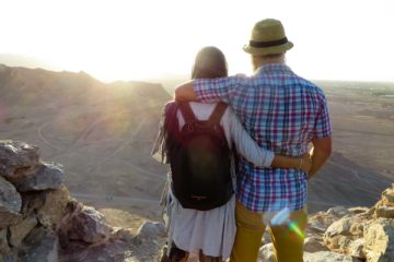 Tiago e Fernanda looking at the sun on top of the mountain in the silent temple in yazd, Iran