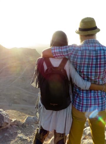 Tiago e Fernanda looking at the sun on top of the mountain in the silent temple in yazd, Iran