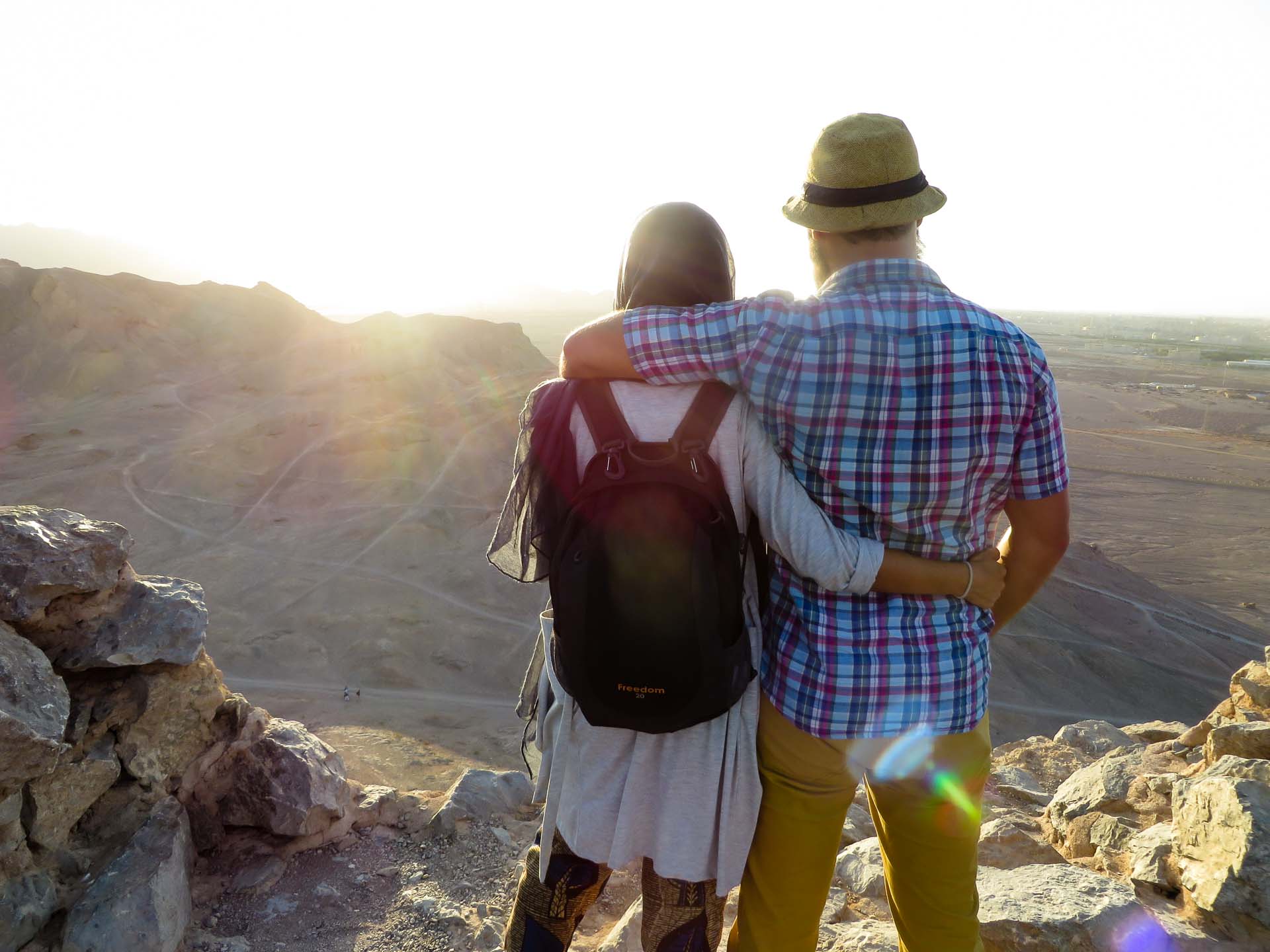 Tiago e Fernanda looking at the sun on top of the mountain in the silent temple in yazd, Iran