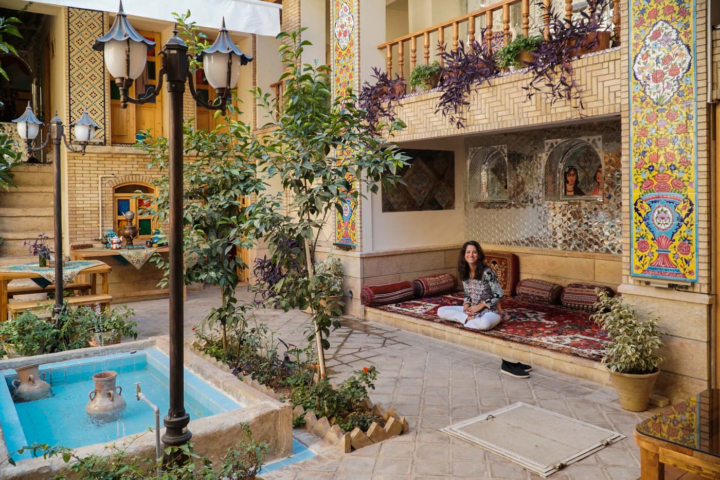 Fernanda sitting in the hall of Homayouni Historical House Hotel