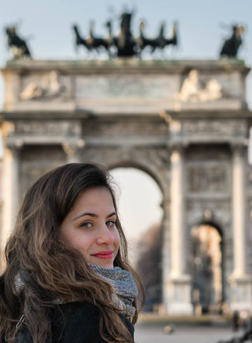 Fe looking back in front of the main arch in Milan Italy