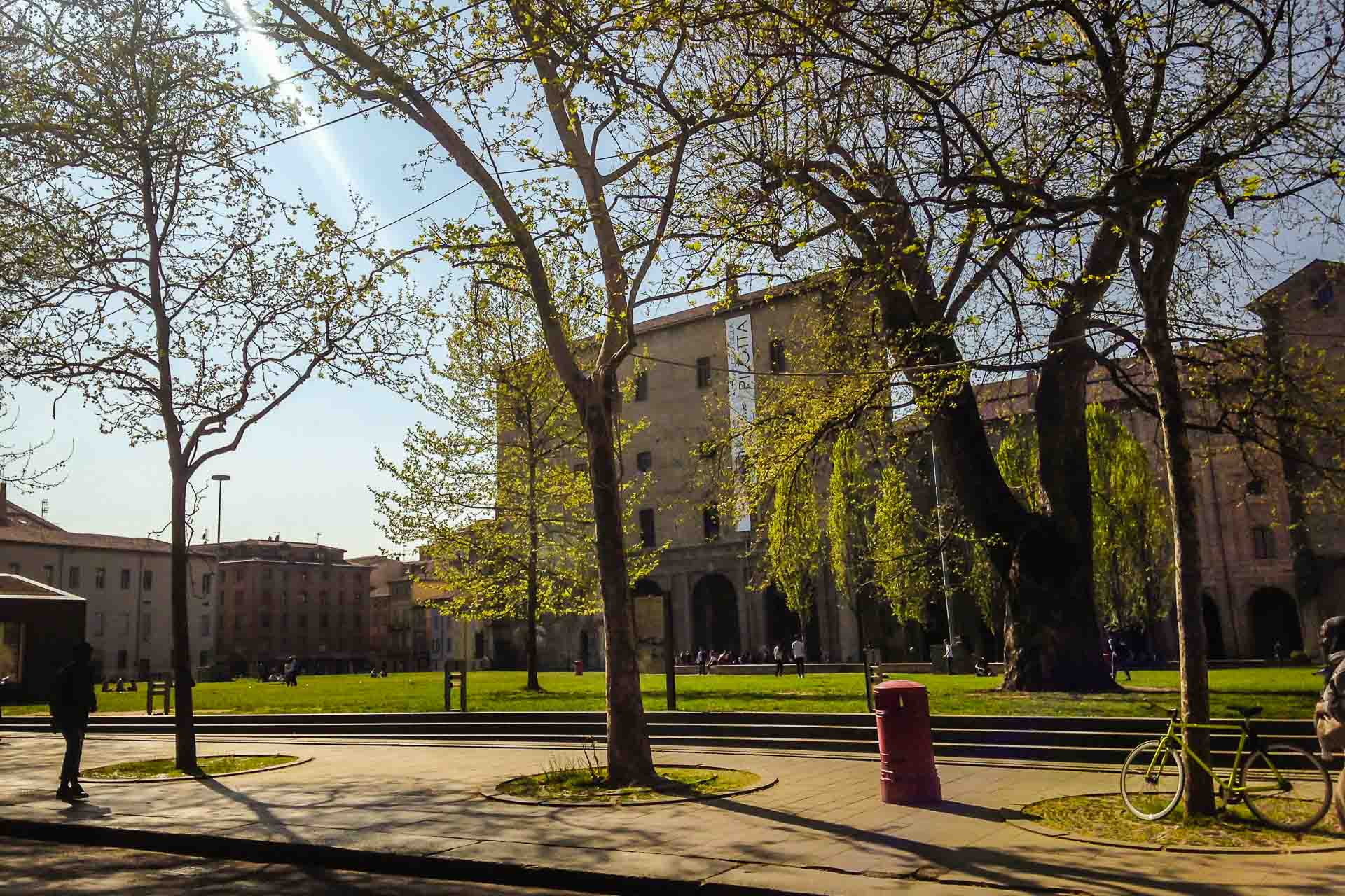 View of the Palazzo della Pilota in Parma with trees in the front in a bright day