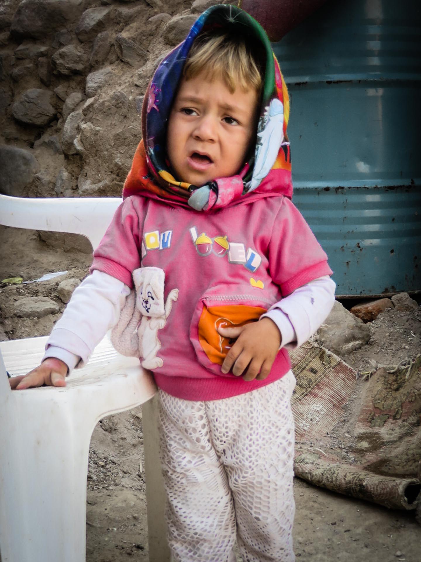 Child with a scarf on the head