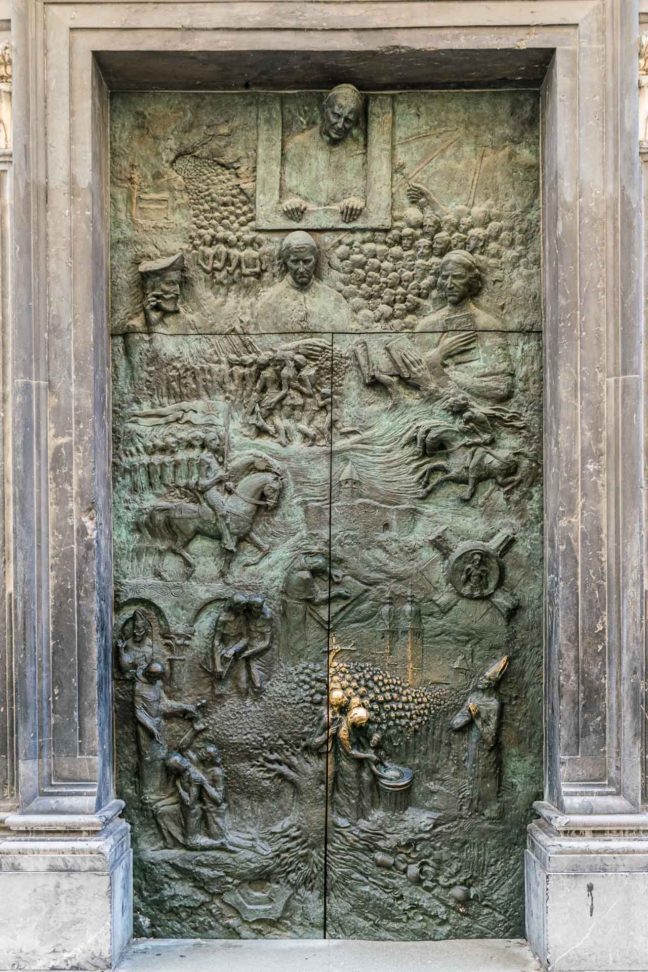 The door of the main church of Ljubljana telling the history of Ljubljana