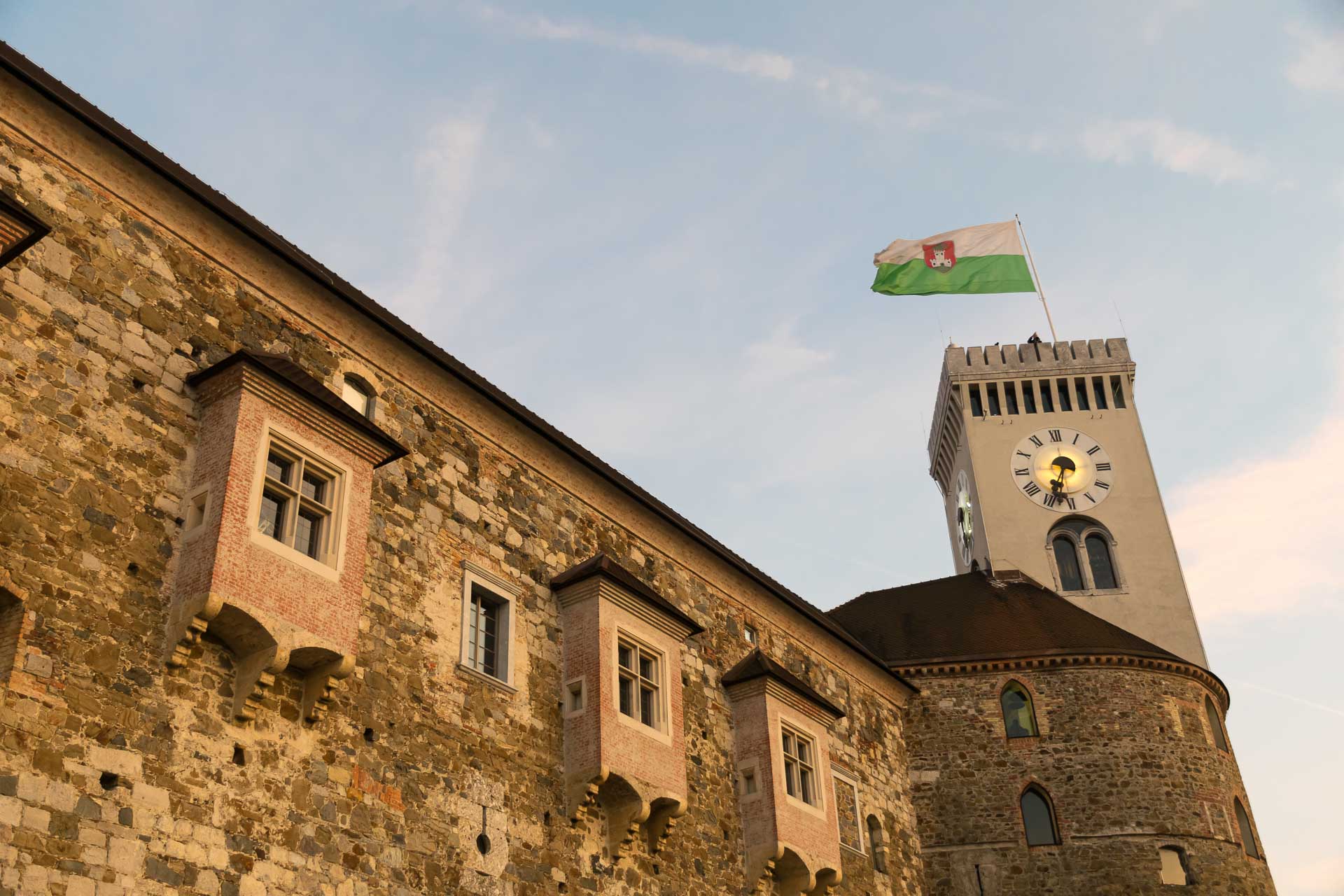 The flag of Ljubljana waving on top of the castle in Ljubljana