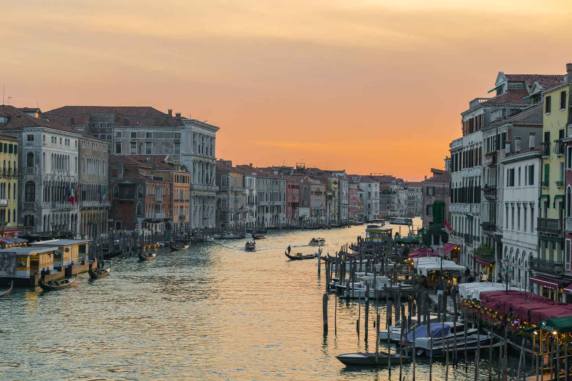 Venice at dusk with the river in the middle and many houses on its margin