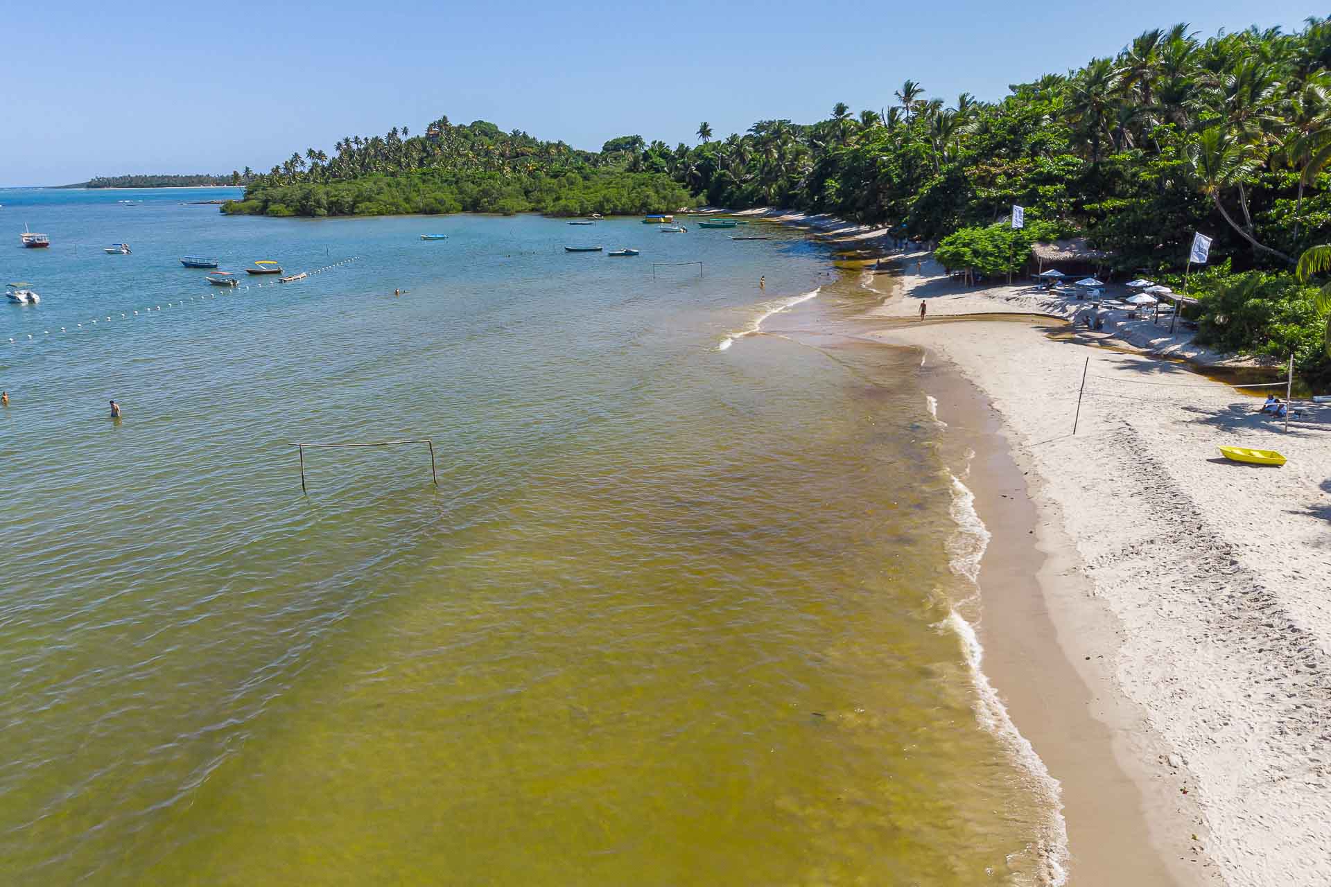 The beach of Morere on high tide with the football goals under the water