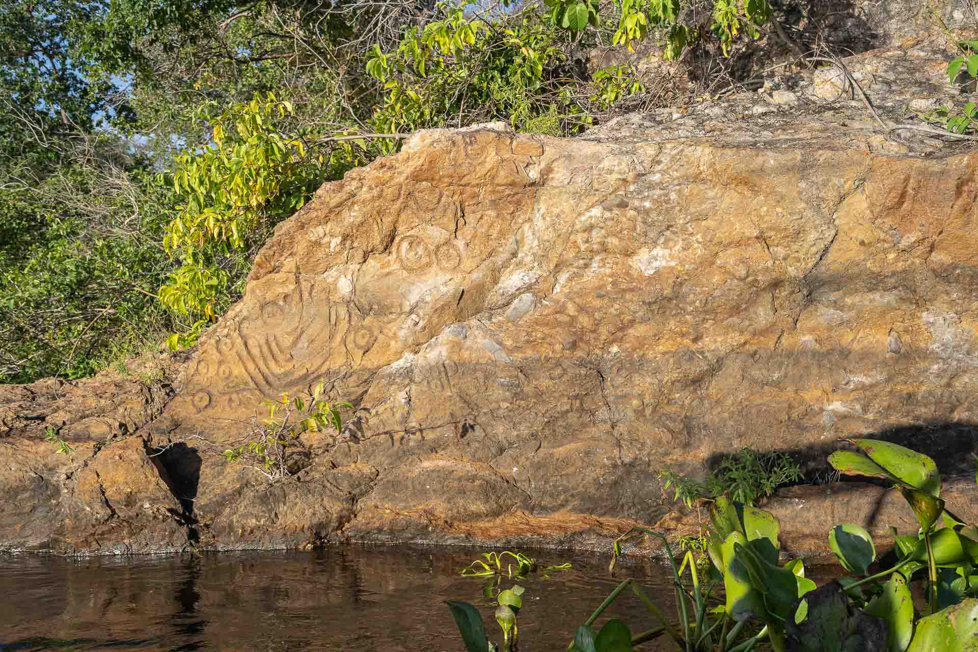 Rupestrian art in a rock by the river in Serra do Amolar