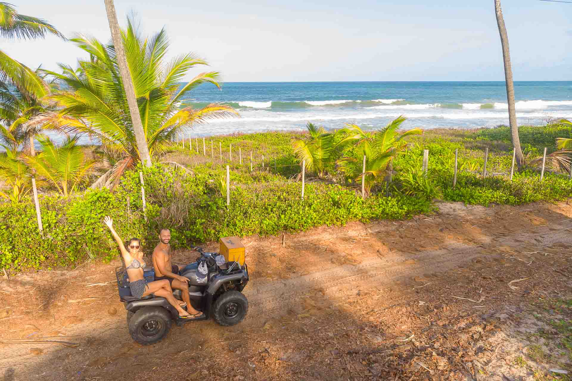 Tiago e Fernanda on a quadri by the beach at Península do Maraú