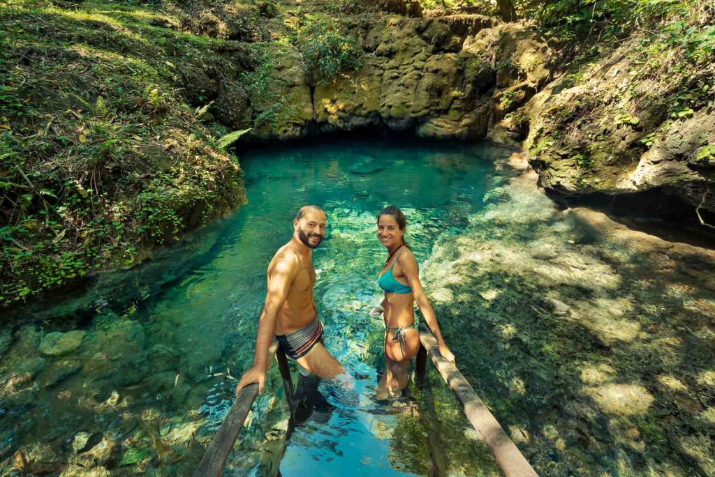Tiago and Fernanda in a crystal clear water