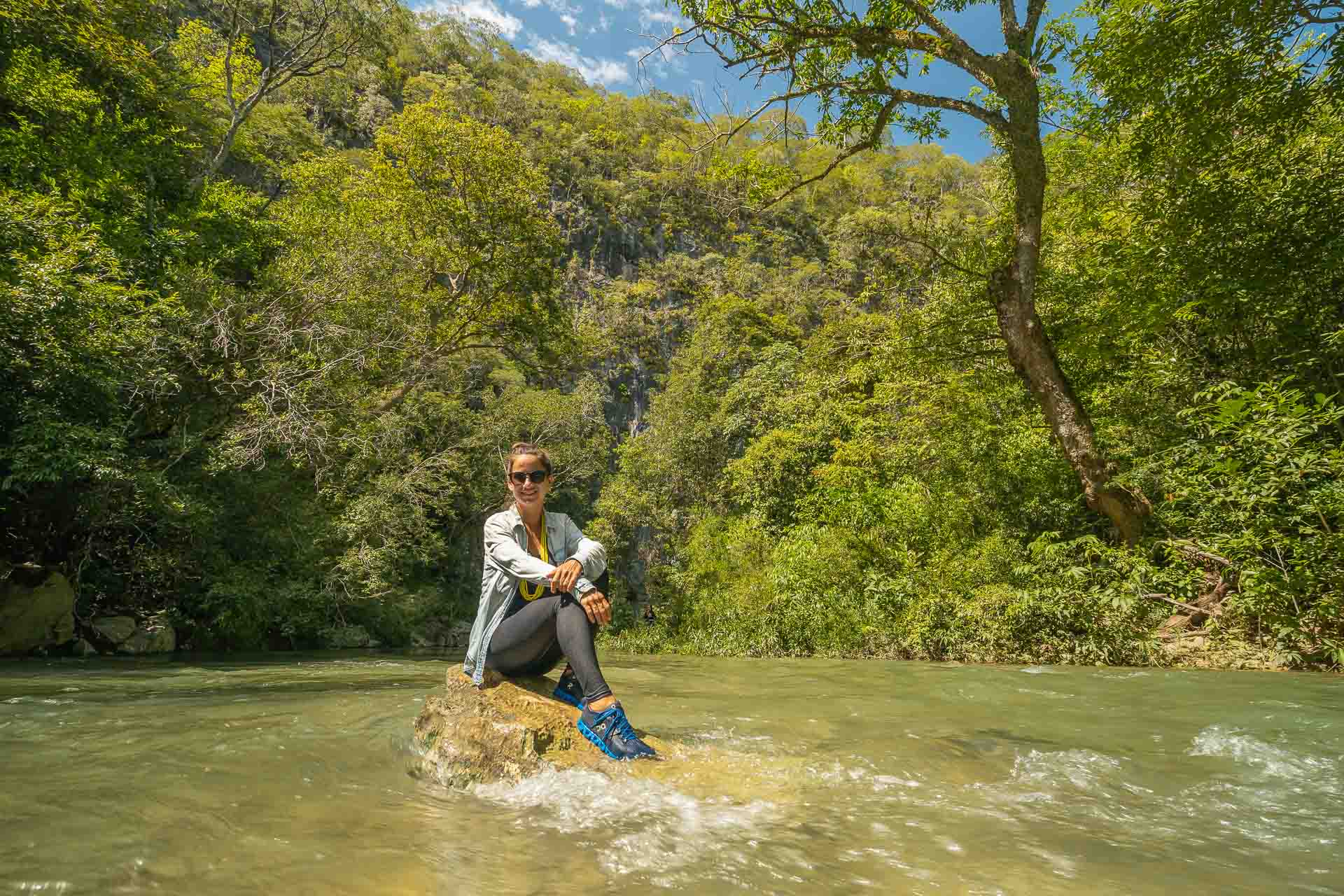 Fernanda posing in the middle of the river