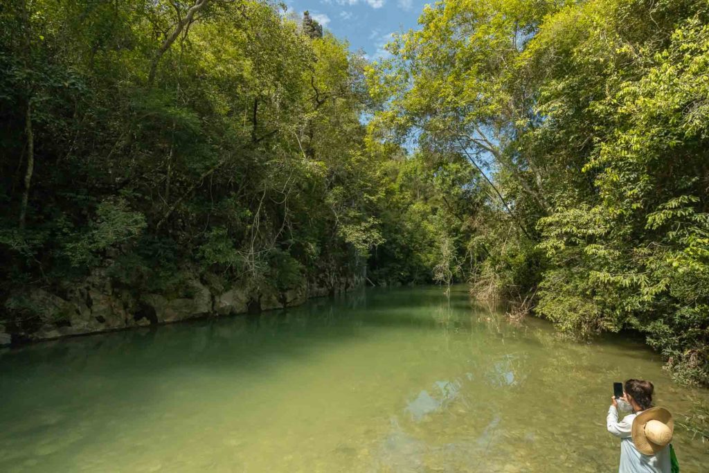 Fernanda taking a photo in the river of Serra da Bodoquena