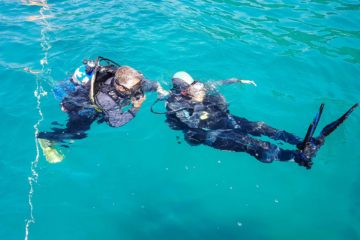 Tiago and the diving instructor in the water