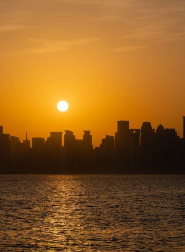 View of the city of Doha seen from the boat during the sunset