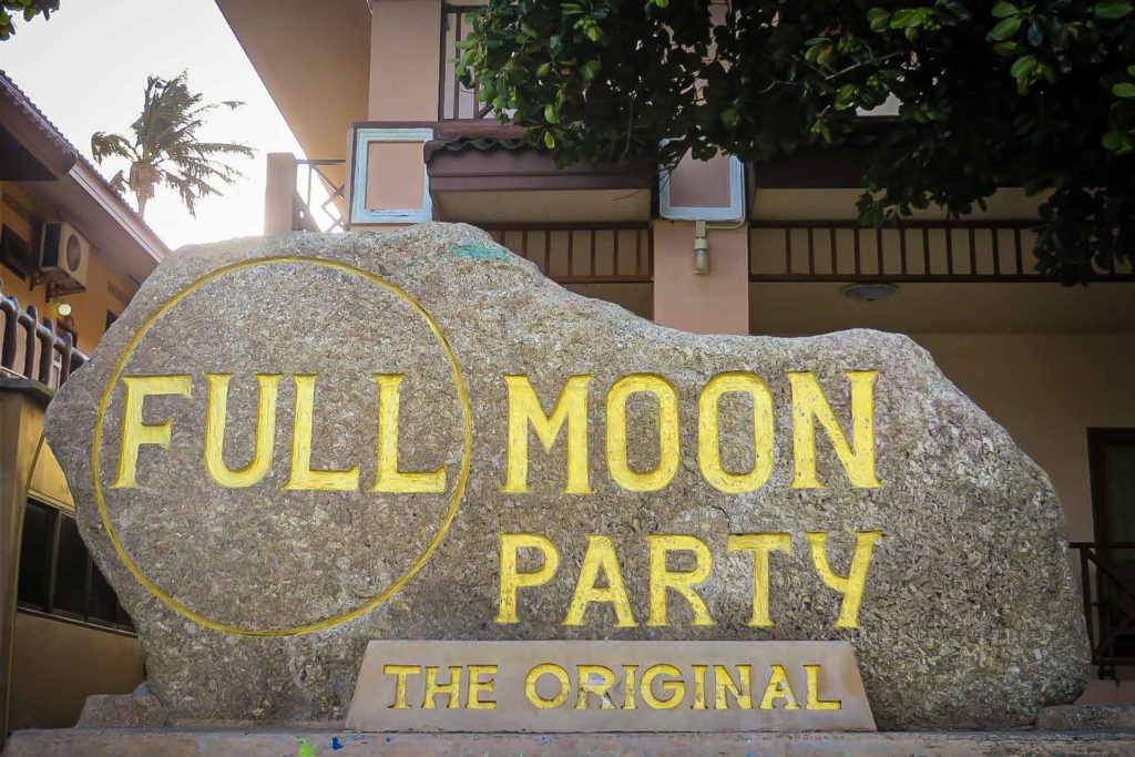 A rock engraved Full Moon Party the original