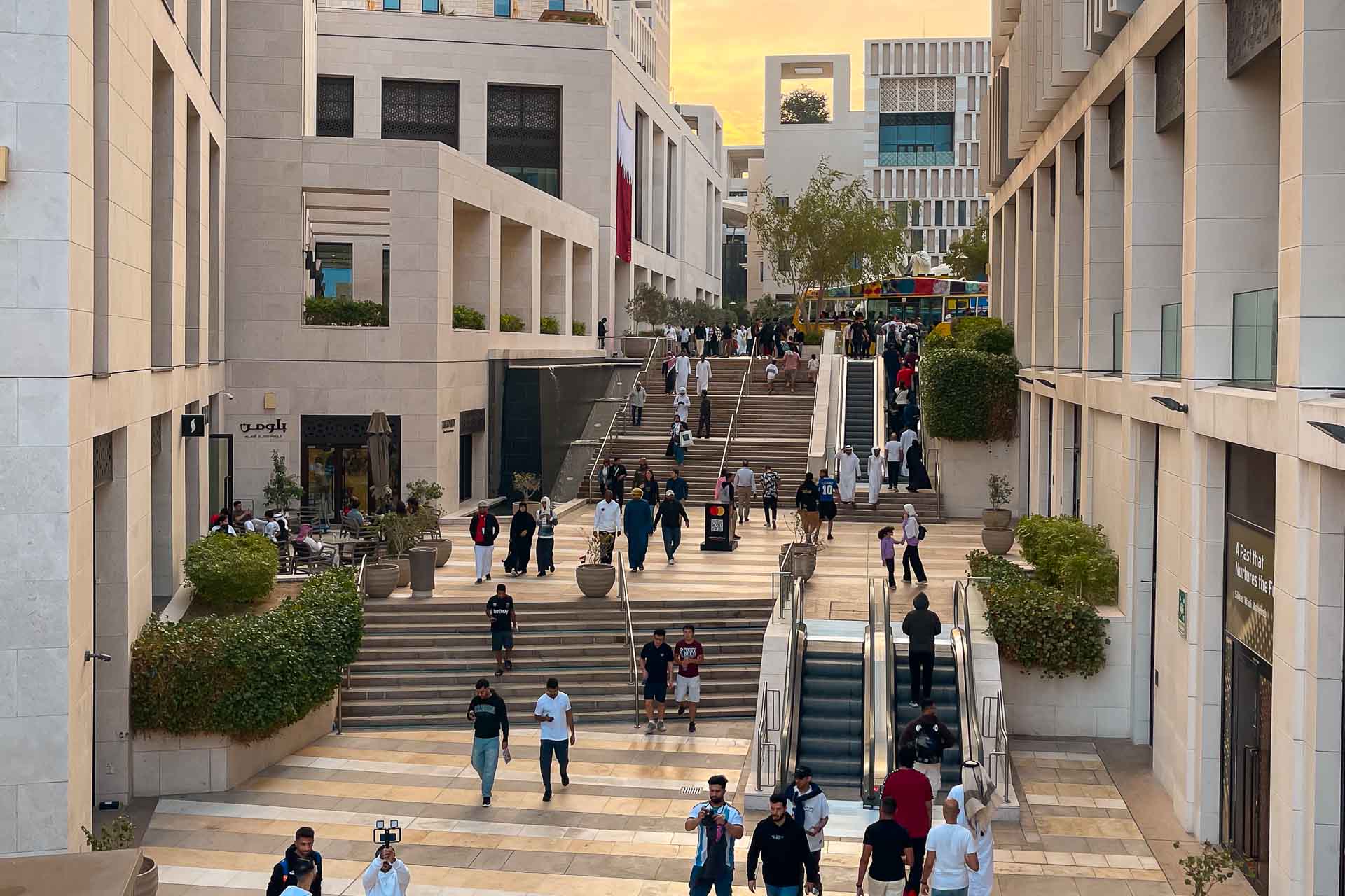 The busy streets with people in central Doha in Qatar