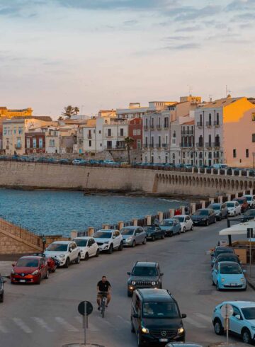 Colourful houses by the sea in the historical city centre of Syracuse in Sicily